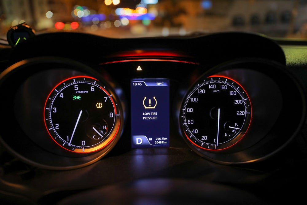 A dashboard displaying a speedometer alongside a clock, used for tracking speed and time metrics.